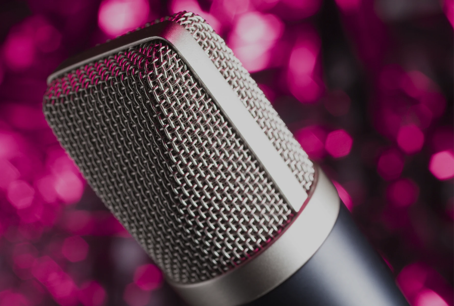 Microphone with blurred pink background