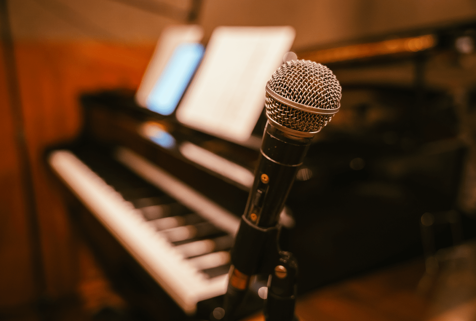 Music studio with microphone and piano